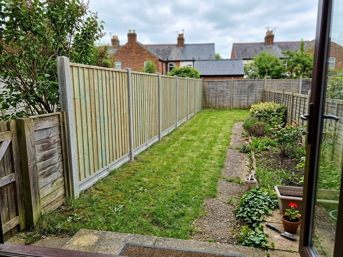 The same garden with a new closeboard fence